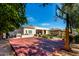 Backyard basketball court with Arizona State markings next to the home with a covered patio and pool at 320 N Portland Ave, Gilbert, AZ 85234