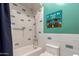 Bathroom with a shower/tub and a colorful, artistic accent wall at 320 N Portland Ave, Gilbert, AZ 85234