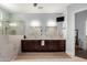Spacious bathroom with a walk-in shower, double vanity, and ample cabinet space at 320 N Portland Ave, Gilbert, AZ 85234