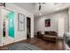 Spacious bedroom with an en suite bathroom, walk in closet and comfortable seating area at 320 N Portland Ave, Gilbert, AZ 85234