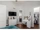 Bedroom with a desk, vanity, and an open door to the closet and bathroom at 320 N Portland Ave, Gilbert, AZ 85234