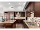 Contemporary kitchen boasting stainless steel appliances and a mosaic backsplash at 320 N Portland Ave, Gilbert, AZ 85234