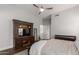 Cozy bedroom including a large bed, media center, and calming paint color at 320 N Portland Ave, Gilbert, AZ 85234