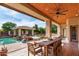 Spacious outdoor patio with dining area, pool, and covered seating at 320 N Portland Ave, Gilbert, AZ 85234