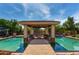 Luxurious pool area with a covered cabana, perfect for outdoor entertaining at 320 N Portland Ave, Gilbert, AZ 85234