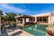 Stunning pool with a swim-up bar and lush landscaping at 320 N Portland Ave, Gilbert, AZ 85234
