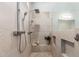 Modern shower with dual shower heads, built-in niches, and neutral tile at 320 N Portland Ave, Gilbert, AZ 85234