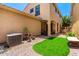 Private backyard with manicured turf, covered patio and stylish gravel landscaping at 3476 E Orchid Ln, Gilbert, AZ 85296