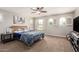 Spacious bedroom with large windows and ceiling fan at 3476 E Orchid Ln, Gilbert, AZ 85296