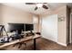 Office bedroom with a ceiling fan, neutral tones, large window, and carpet floors at 3476 E Orchid Ln, Gilbert, AZ 85296