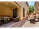 Stylish covered patio with an outdoor dining area and lounge seating for entertaining guests at 3476 E Orchid Ln, Gilbert, AZ 85296