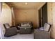 Cozy covered patio with outdoor seating and string lights for relaxation and entertainment at 3476 E Orchid Ln, Gilbert, AZ 85296