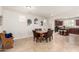 Open-concept dining area with tile floors, seamlessly connecting to the kitchen at 3476 E Orchid Ln, Gilbert, AZ 85296