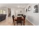 Bright dining room with tile floors and horse-themed decor at 3476 E Orchid Ln, Gilbert, AZ 85296