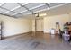 A spacious two car garage features an epoxy floor with plenty of room for storage and projects at 3476 E Orchid Ln, Gilbert, AZ 85296