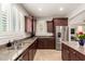 Bright, open kitchen featuring granite countertops and stainless steel appliances at 3476 E Orchid Ln, Gilbert, AZ 85296