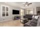 Comfortable living room features neutral decor, modern furnishings, and bright, shuttered windows at 3476 E Orchid Ln, Gilbert, AZ 85296