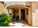 Inviting front porch with comfortable seating and a welcoming entrance at 3476 E Orchid Ln, Gilbert, AZ 85296