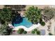 Aerial view of a backyard pool, patio, and lush landscaping, showcasing a private outdoor retreat at 35654 N Vidlak Dr, San Tan Valley, AZ 85143