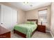 This bedroom features a cozy bed, neutral walls, and a window with blinds for ample natural light at 35654 N Vidlak Dr, San Tan Valley, AZ 85143