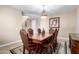 Elegant dining room featuring a large table with seating for six and stylish chandelier lighting at 35654 N Vidlak Dr, San Tan Valley, AZ 85143