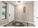 Inviting foyer with decorative rug and adjacent staircase exudes a warm ambiance at 35654 N Vidlak Dr, San Tan Valley, AZ 85143