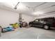 The interior of the garage features storage shelves and toolboxes and a black SUV at 35654 N Vidlak Dr, San Tan Valley, AZ 85143