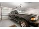 Garage interior featuring a black SUV, with a garage door opener system at 35654 N Vidlak Dr, San Tan Valley, AZ 85143
