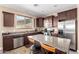 Modern kitchen boasts stainless steel appliances, granite countertops, and a center island at 35654 N Vidlak Dr, San Tan Valley, AZ 85143