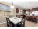 Eat-in kitchen with an island, granite countertops, pendant lighting, and stainless steel appliances at 35654 N Vidlak Dr, San Tan Valley, AZ 85143