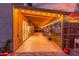 Inviting covered back patio with string lights, creating a warm and welcoming outdoor space at 3805 E Desert Flower Ln, Phoenix, AZ 85044