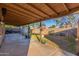 Back patio featuring an area for grilling and an area for outdoor entertaining at 3805 E Desert Flower Ln, Phoenix, AZ 85044