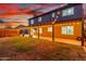 Large backyard featuring string lights, a covered patio, and ample space for outdoor activities at 3805 E Desert Flower Ln, Phoenix, AZ 85044