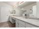 Bright bathroom featuring double sinks, granite countertops and large mirror at 3805 E Desert Flower Ln, Phoenix, AZ 85044