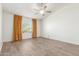 Large bedroom with ceiling fan and a window that provides natural light at 3805 E Desert Flower Ln, Phoenix, AZ 85044