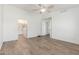 Spacious bedroom with ceiling fan and wood-look flooring at 3805 E Desert Flower Ln, Phoenix, AZ 85044
