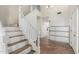Inviting entryway featuring tiled staircase and wood-look flooring at 3805 E Desert Flower Ln, Phoenix, AZ 85044