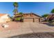 Charming two-story home boasts a spacious three-car garage and well-manicured desert landscaping at 3805 E Desert Flower Ln, Phoenix, AZ 85044