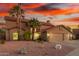 Charming two-story home boasts a spacious three-car garage and well-manicured desert landscaping at 3805 E Desert Flower Ln, Phoenix, AZ 85044