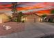 Charming two-story home boasts a spacious three-car garage and well-manicured desert landscaping at 3805 E Desert Flower Ln, Phoenix, AZ 85044