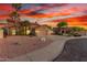 Charming two-story home boasts a spacious three-car garage and well-manicured desert landscaping at 3805 E Desert Flower Ln, Phoenix, AZ 85044