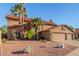 A delightful exterior view showcases a desert home with a well-manicured landscape and a three-car garage at 3805 E Desert Flower Ln, Phoenix, AZ 85044