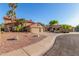 Charming desert home featuring well-maintained landscaping, mature palm trees, and a three-car garage at 3805 E Desert Flower Ln, Phoenix, AZ 85044