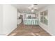 Charming kitchen featuring white cabinets, breakfast bar, stainless appliances and wood-look floors at 3805 E Desert Flower Ln, Phoenix, AZ 85044