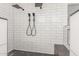 Luxurious walk-in shower with dual shower heads and white subway tile at 3805 E Desert Flower Ln, Phoenix, AZ 85044