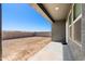 Back yard with a concrete patio, block wall, and lots of potential at 38099 N Stallion St, San Tan Valley, AZ 85140