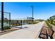 Community park area featuring benches and a walking path on a sunny day at 38099 N Stallion St, San Tan Valley, AZ 85140