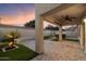 Outdoor living area with brick patio, artificial turf, and a hot tub at 3932 S Crosscreek Dr, Chandler, AZ 85286