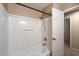 Clean white bathtub/shower combo features a showerhead and convenient access to the bathroom door at 3932 S Crosscreek Dr, Chandler, AZ 85286