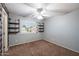 Empty bedroom with great natural light, a ceiling fan, and modern shelving is ready for your personal touch at 3932 S Crosscreek Dr, Chandler, AZ 85286